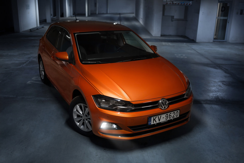 Orange VW Polo in underground car park