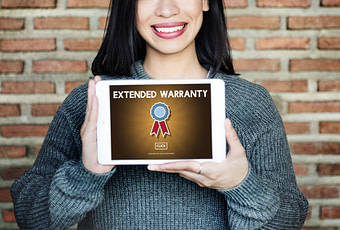 Lady holding a tablet showing extended car warranties